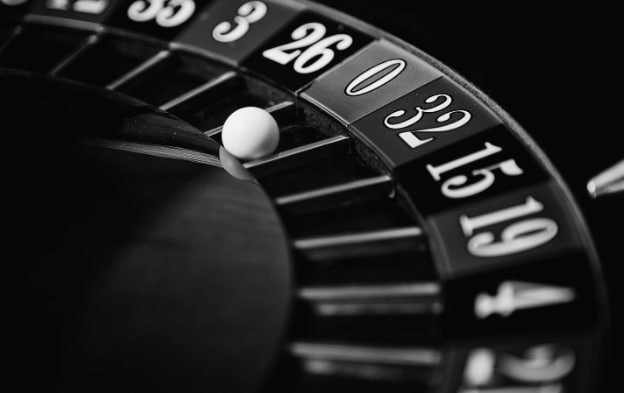 koko138 slot roulette wheel during spin with ball in motion